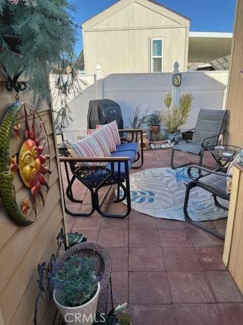 70201 Aurora Road, Unit 176 Desert Hot Springs, CA 92240 - Photo 3 of 17 a view of a chairs and tables in the patio