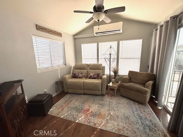 70201 Aurora Road, Unit 176 Desert Hot Springs, CA 92241 - Photo 5 of 17 a living room with furniture and a large window