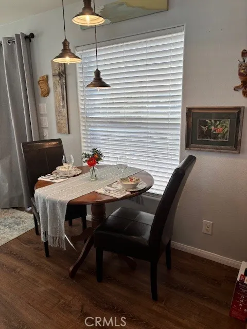 70201 Aurora Road, Unit 176 Desert Hot Springs, CA 92241 - Photo 6 of 17 a dining room with furniture and wooden floor
