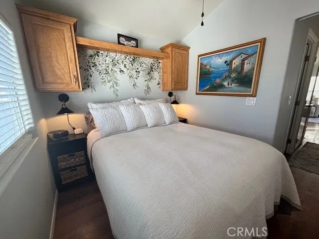 70201 Aurora Road, Unit 176 Desert Hot Springs, CA 92241 - Photo 8 of 17 a bed room with a bed and a painting