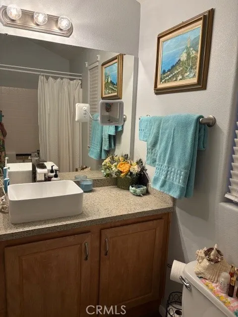 70201 Aurora Road, Unit 176 Desert Hot Springs, CA 92240 - Photo 10 of 17 a bathroom with a sink mirror and vanity