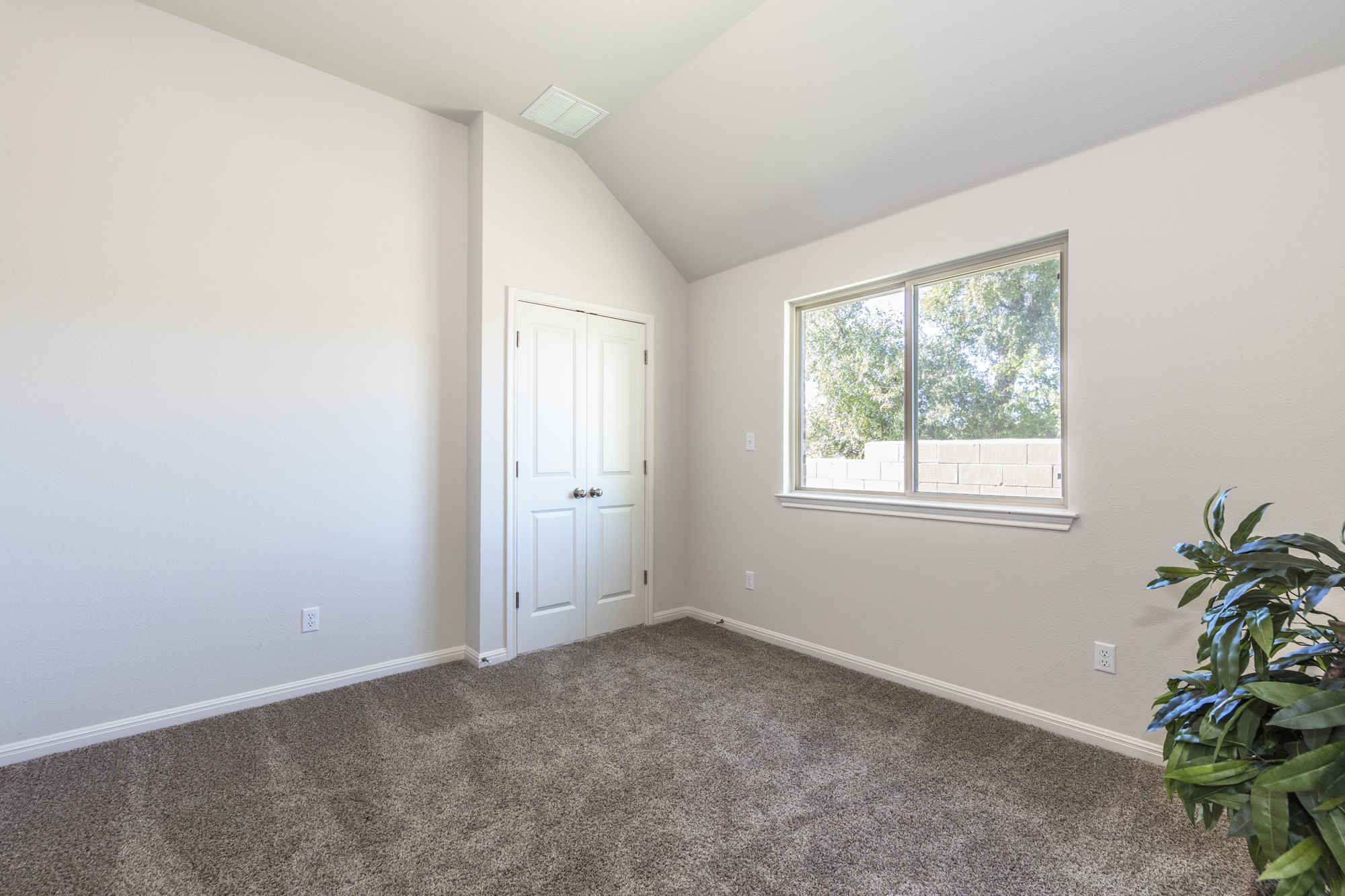 2725 Hopi Path Leander, TX 78641 - Photo 12 of 30 A well-lit bedroom features plush carpeting and a window offering natural illumination.