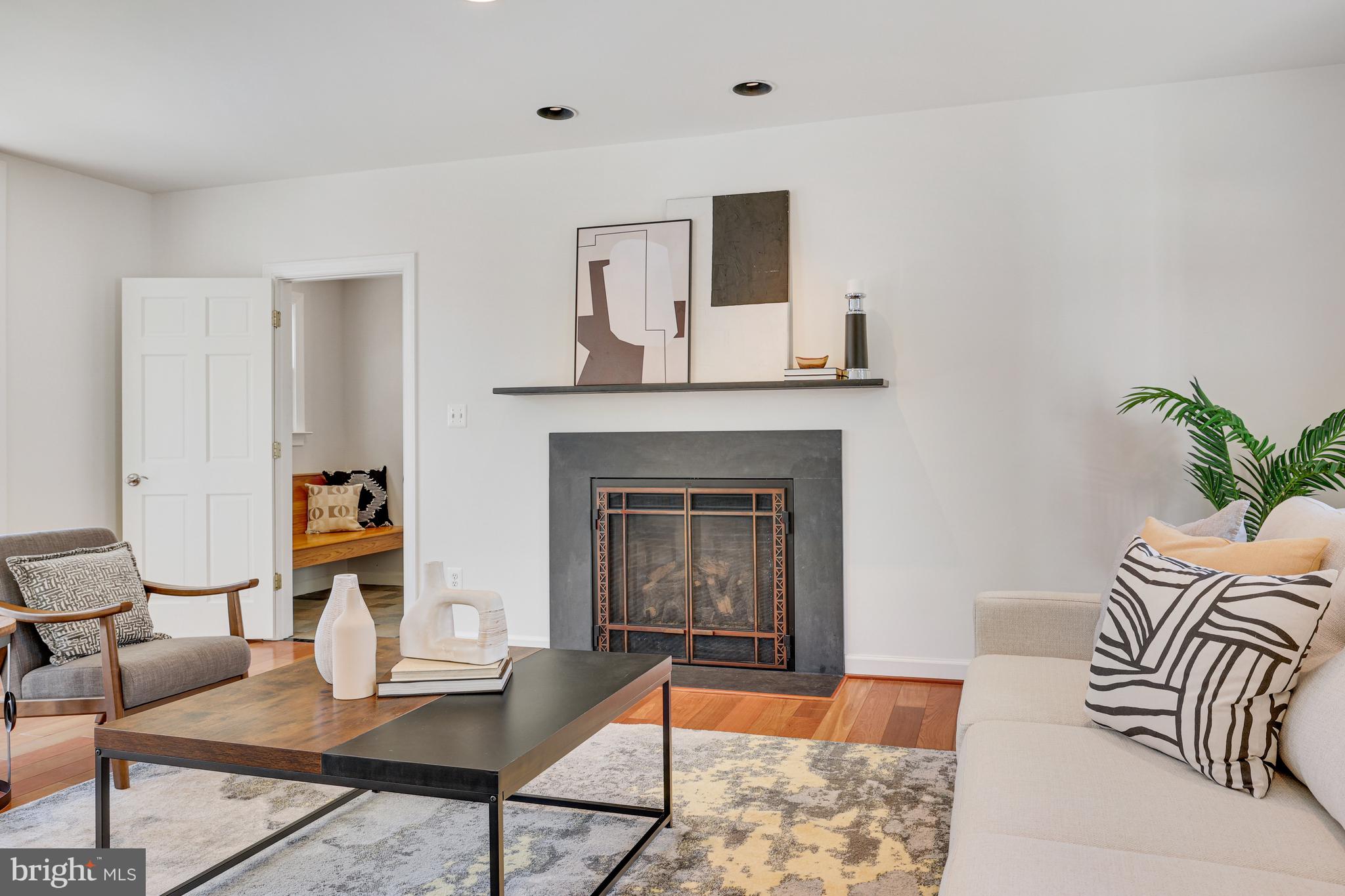 1807 Post Oak Trail Reston, VA 20191 - Photo 12 of 79 a living room with furniture and a fireplace