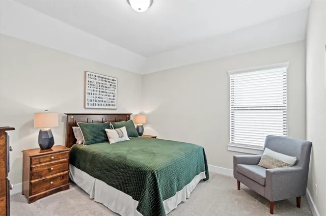 a bedroom with a bed and a couch