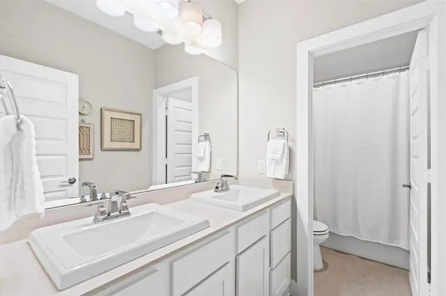 a bathroom with a sink vanity and a mirror