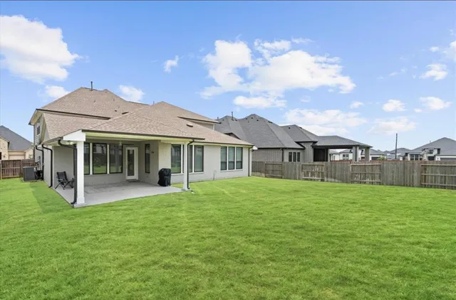 a front view of a house with a garden and porch