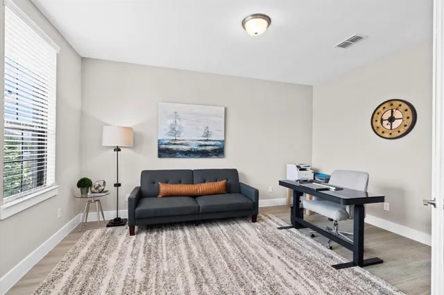 a living room with furniture and a table