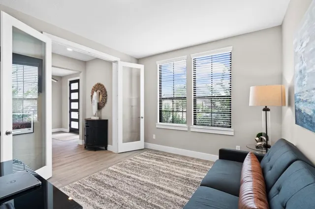 a living room with furniture and a window