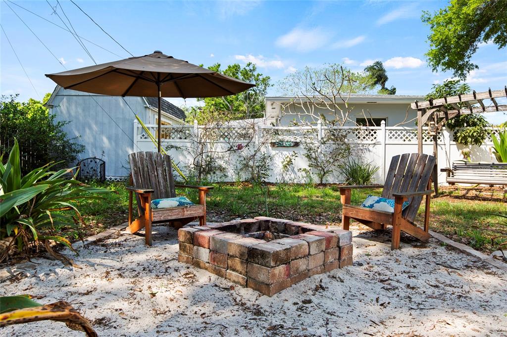1361 Belleair Road Clearwater, FL 33756 - Photo 13 of 19 a view of a backyard with sitting area and furniture