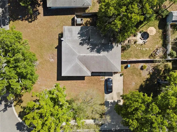 an aerial view of residential house with outdoor space and swimming pool