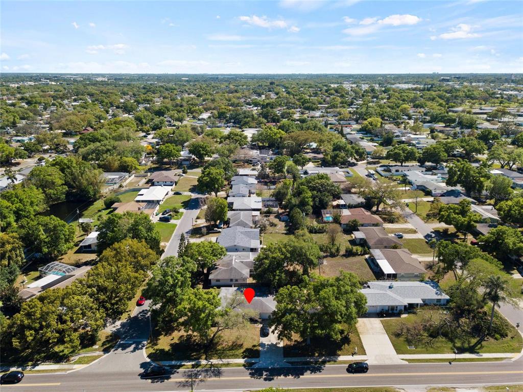 1361 Belleair Road Clearwater, FL 33756 - Photo 18 of 19 an aerial view of residential houses with outdoor space and trees