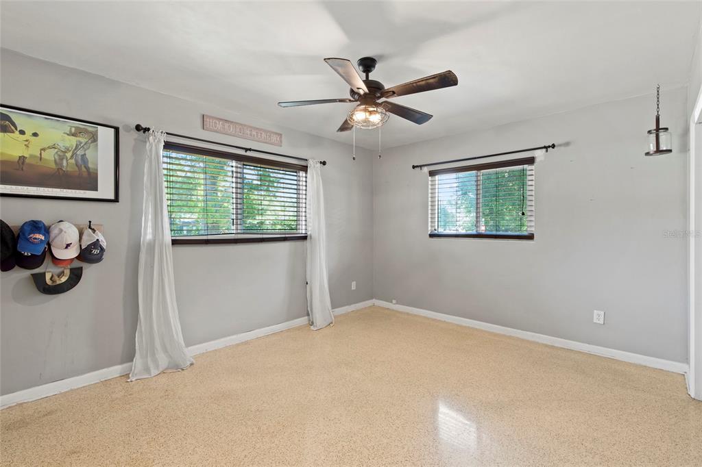 1361 Belleair Road Clearwater, FL 33756 - Photo 8 of 19 a view of an empty room with window and wooden floor