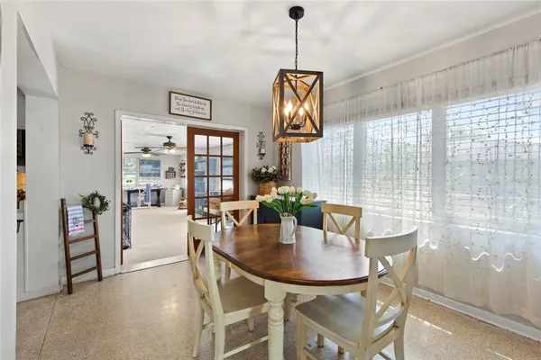 a dining room with furniture and window