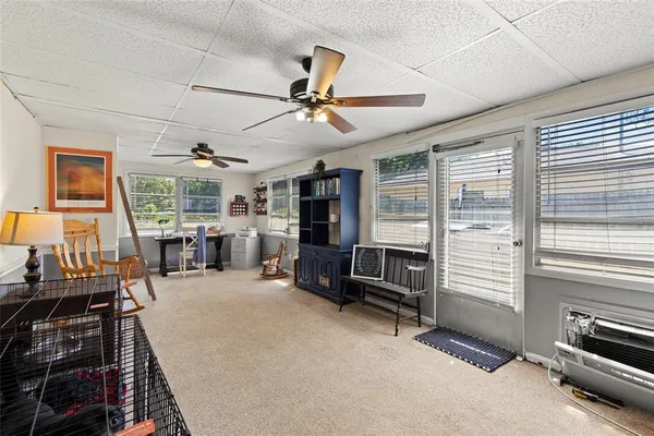 an empty room with furniture and windows