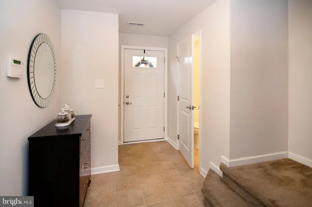 a view of a bathroom with a sink and a mirror
