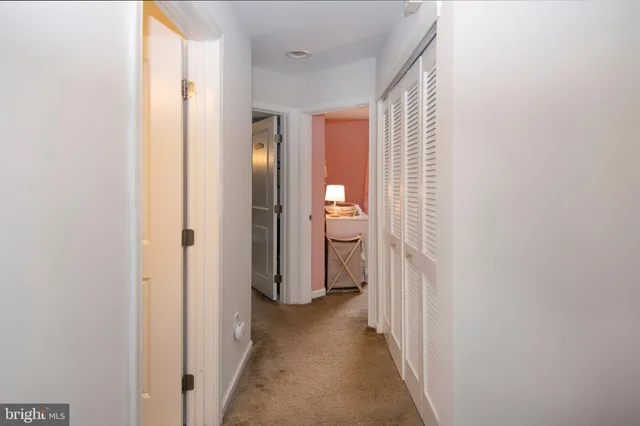 a view of a bathroom from a hallway
