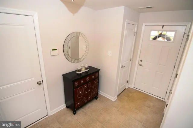 a room with a table and a mirror