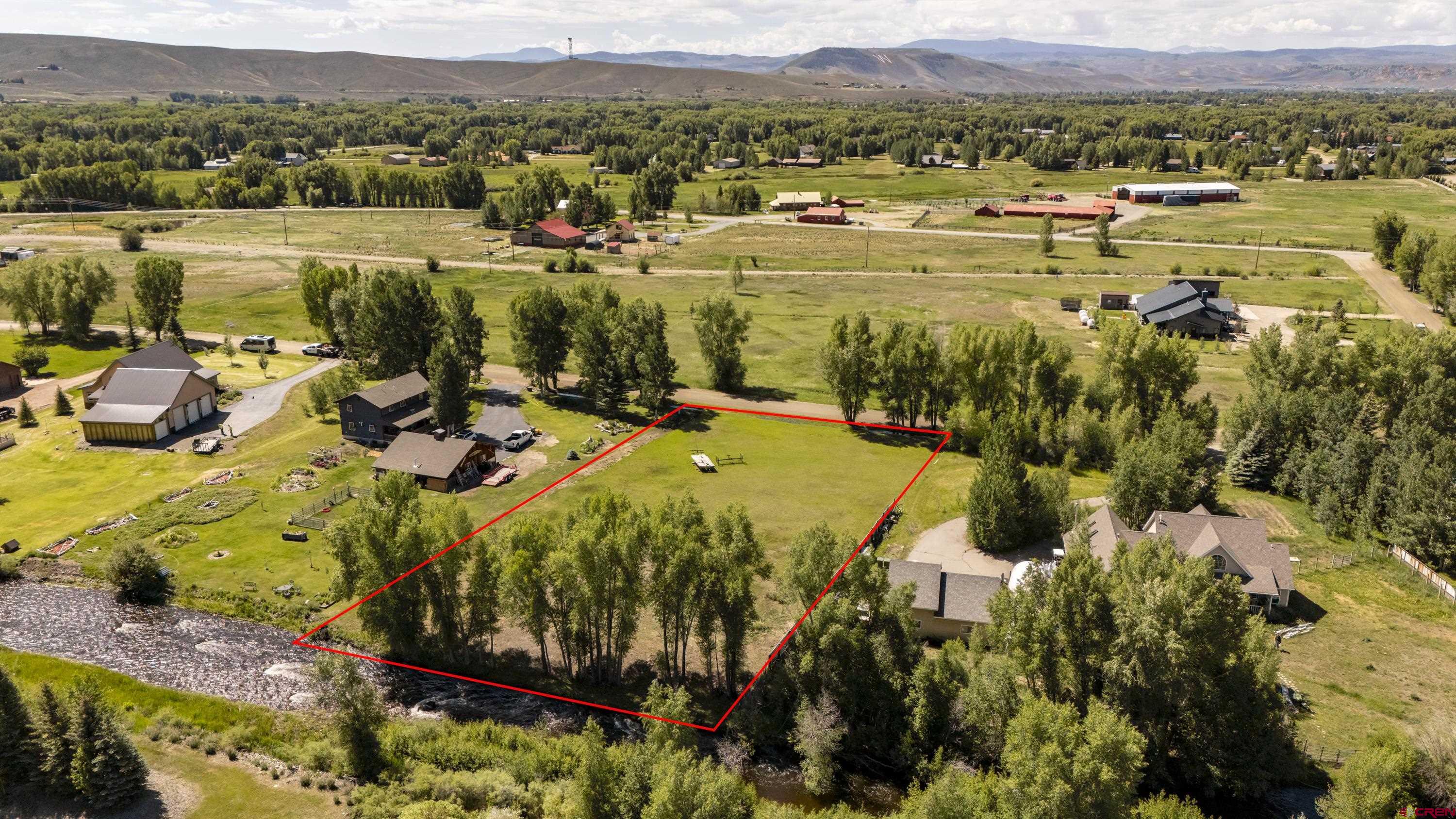 205 Spring Meadow Trail Gunnison, CO 81230 - Photo 18 of 34 a view of a lake with a mountain