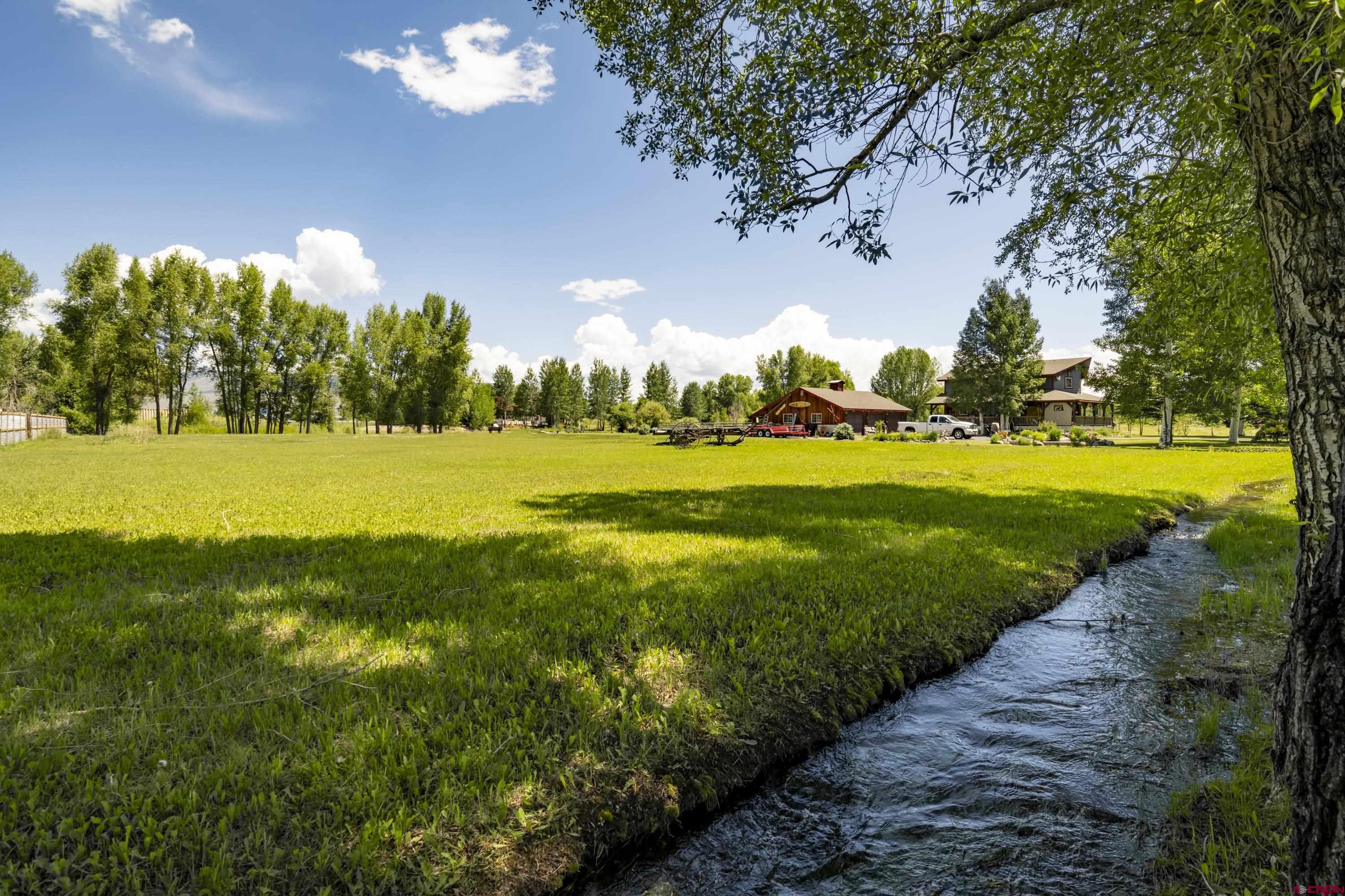 205 Spring Meadow Trail Gunnison, CO 81230 - Photo 2 of 34 a view of a golf club with a big yard