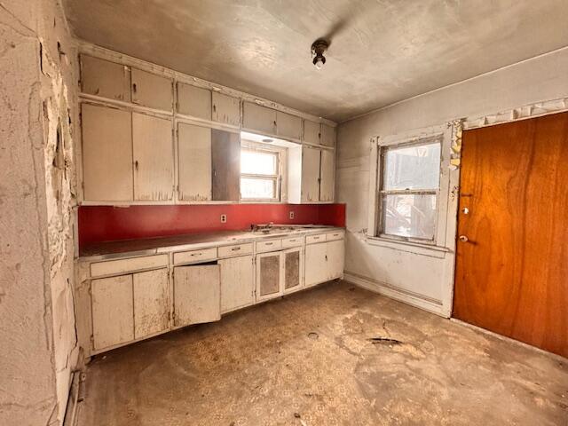 640 Polk Street Gary, IN 46402 - Photo 2 of 16 a kitchen with granite countertop a refrigerator and a sink