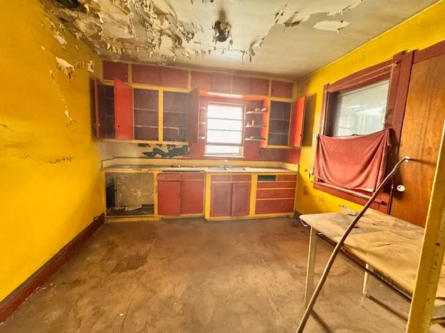 a kitchen with stainless steel appliances granite countertop a stove a sink and dishwasher with granite countertops