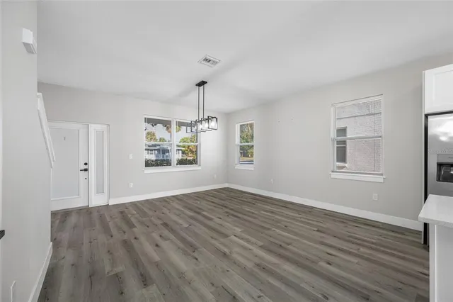 a kitchen with stainless steel appliances a sink a stove and cabinets