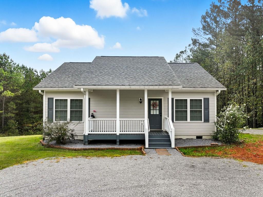 a front view of a house with garden