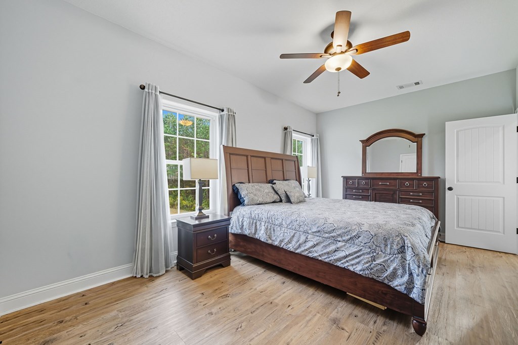 716 Old Pleasant Valley Road Talking Rock, GA 30175 - Photo 29 of 58 a bedroom with a large bed and a window