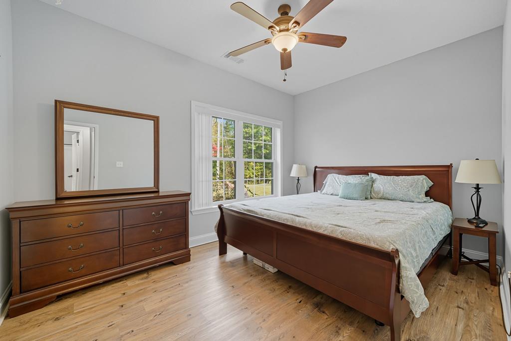 716 Old Pleasant Valley Road Talking Rock, GA 30175 - Photo 39 of 58 a bedroom with a bed and a chandelier
