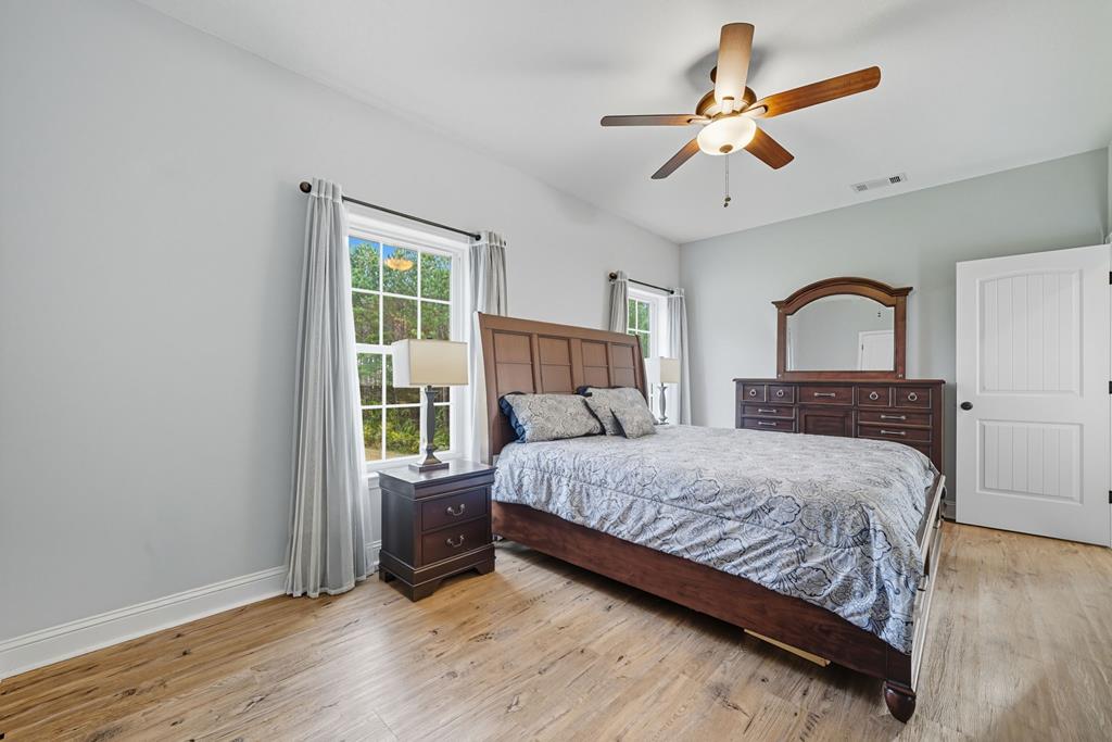 716 Old Pleasant Valley Road Talking Rock, GA 30175 - Photo 40 of 58 a bedroom with a large bed and a window