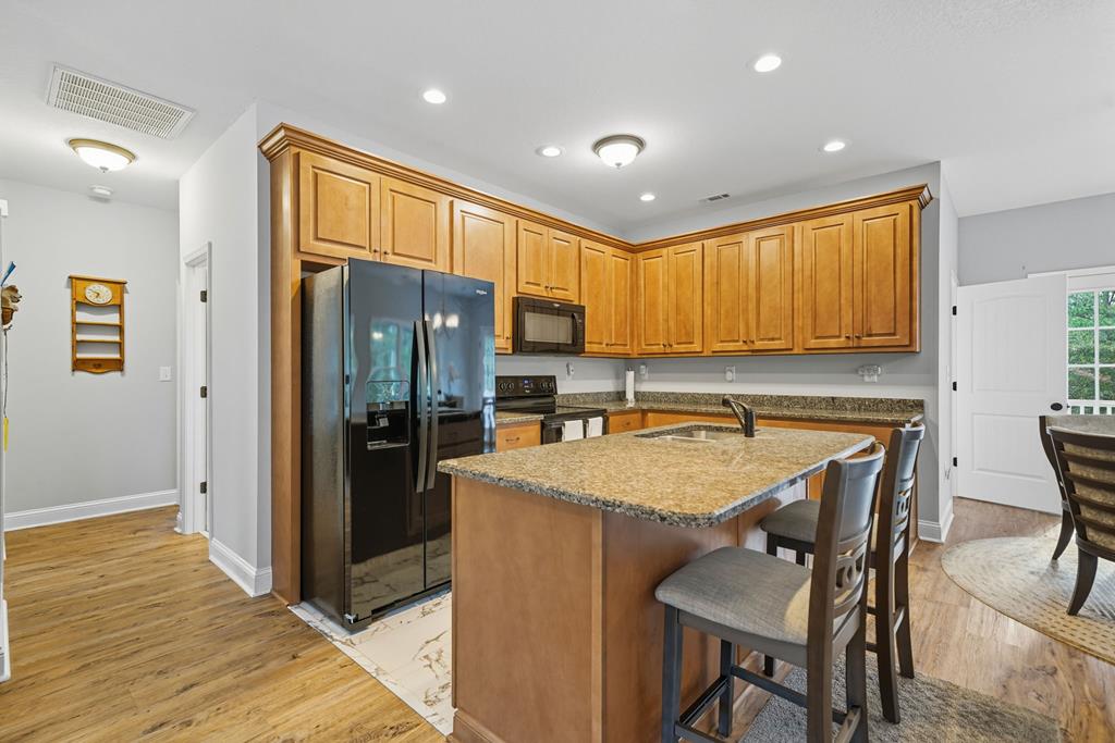716 Old Pleasant Valley Road Talking Rock, GA 30175 - Photo 51 of 58 a kitchen with granite countertop a refrigerator stove top oven and sink