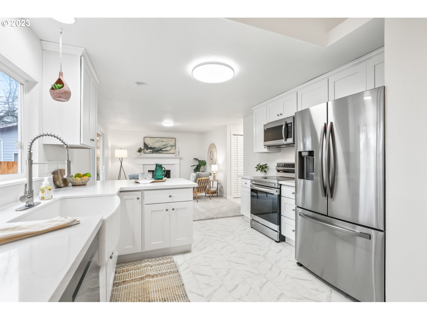 1203 Southeast Barnes Road Gresham, OR 97080 - Photo 12 of 43 a kitchen with a refrigerator sink and stove