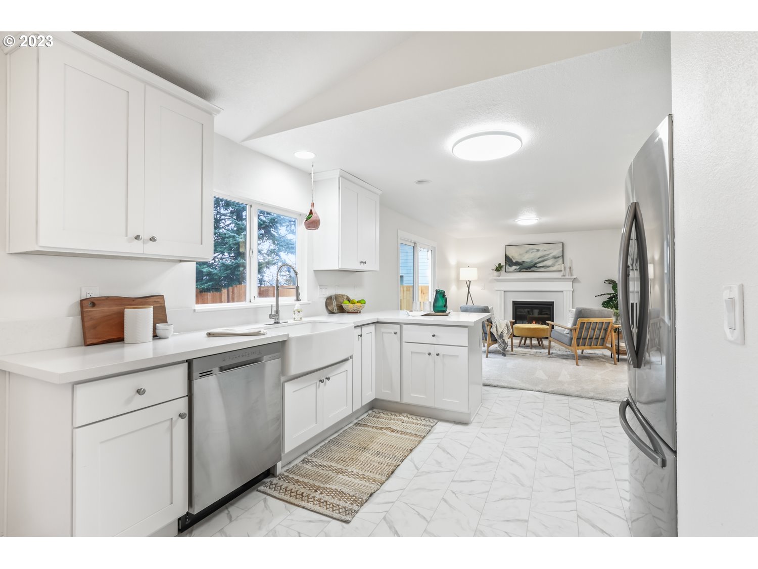 1203 Southeast Barnes Road Gresham, OR 97080 - Photo 13 of 43 a kitchen with a sink cabinets and window
