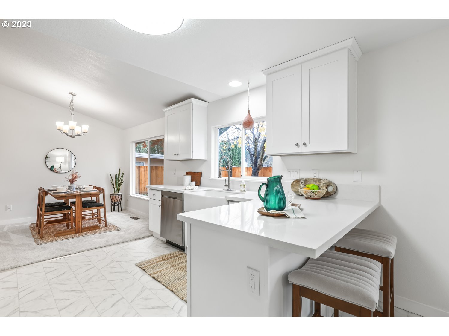 1203 Southeast Barnes Road Gresham, OR 97080 - Photo 15 of 43 a living room with furniture and a dining table