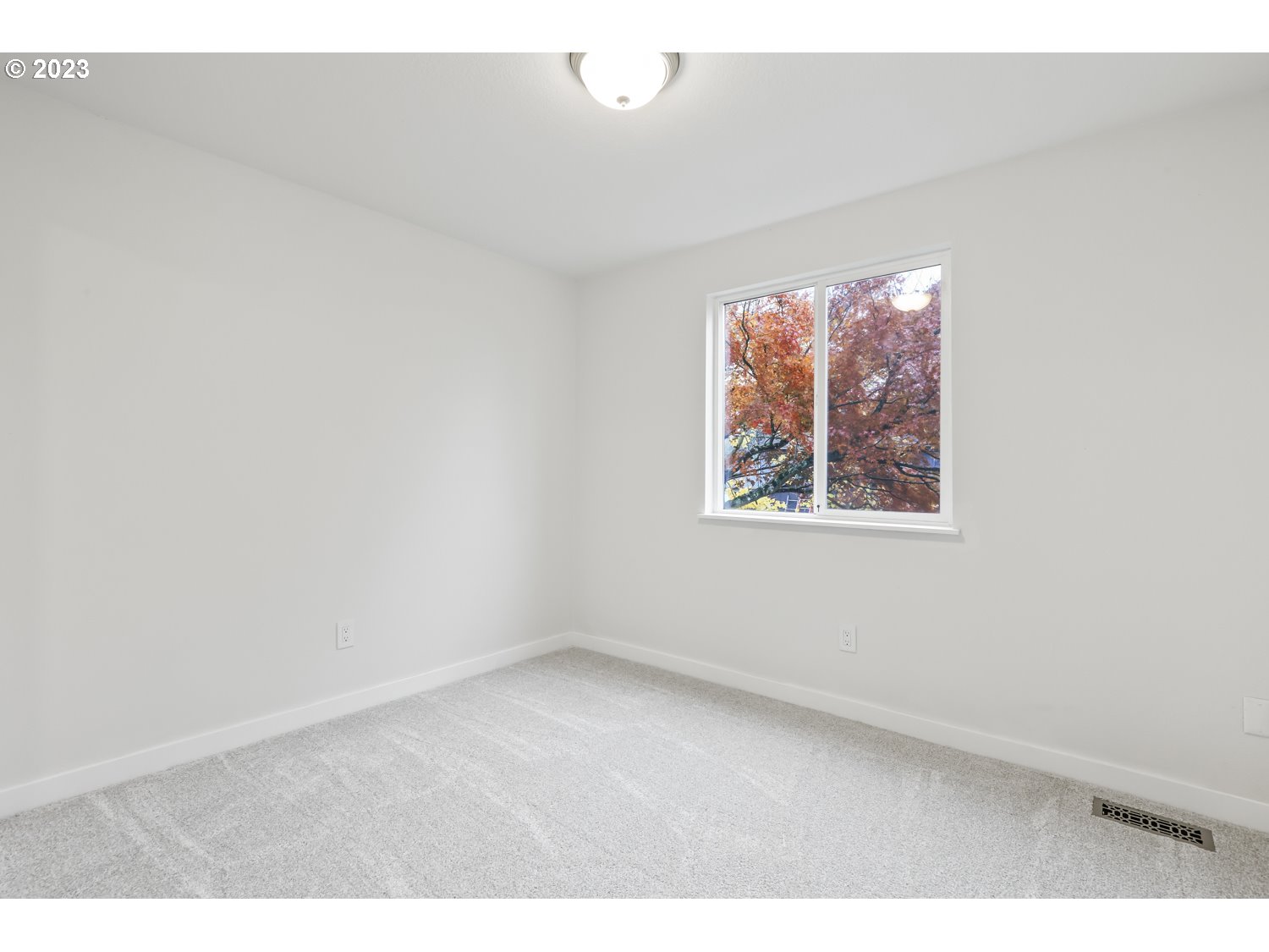 1203 Southeast Barnes Road Gresham, OR 97080 - Photo 22 of 43 an empty room with a window