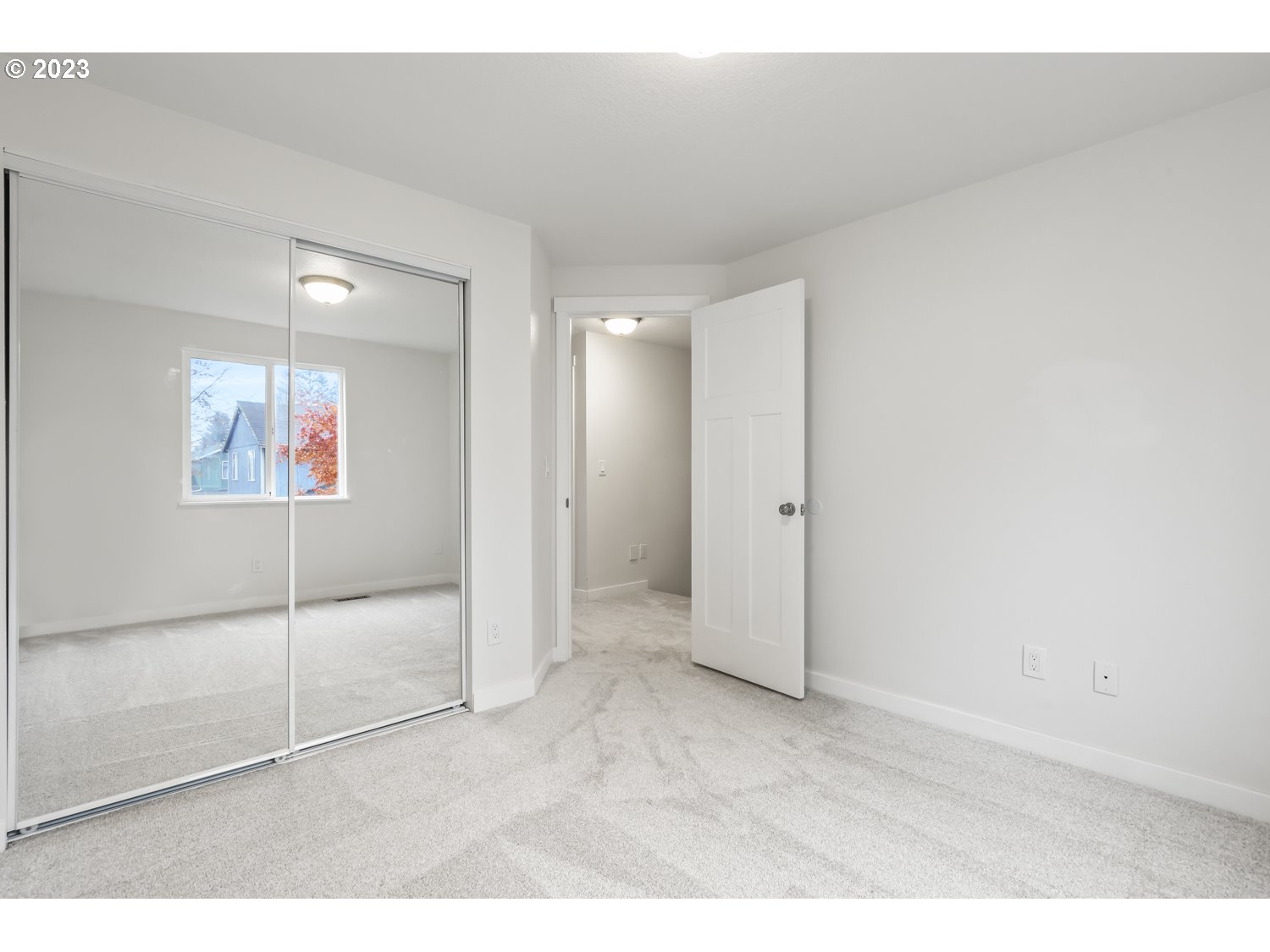 1203 Southeast Barnes Road Gresham, OR 97080 - Photo 26 of 43 a view of a big room with wooden floor and windows