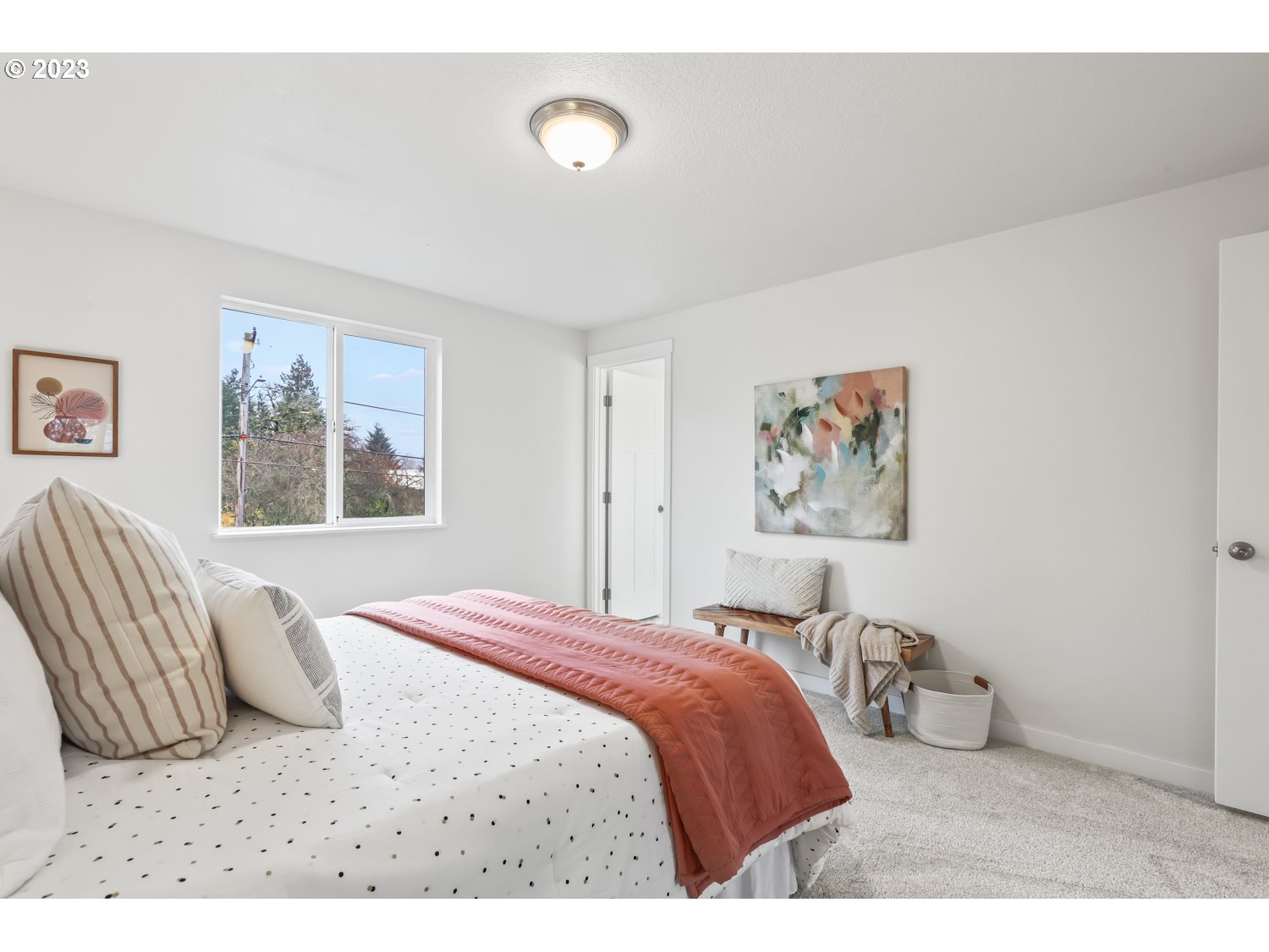 1203 Southeast Barnes Road Gresham, OR 97080 - Photo 27 of 43 a bedroom with a bed and a painting on the wall