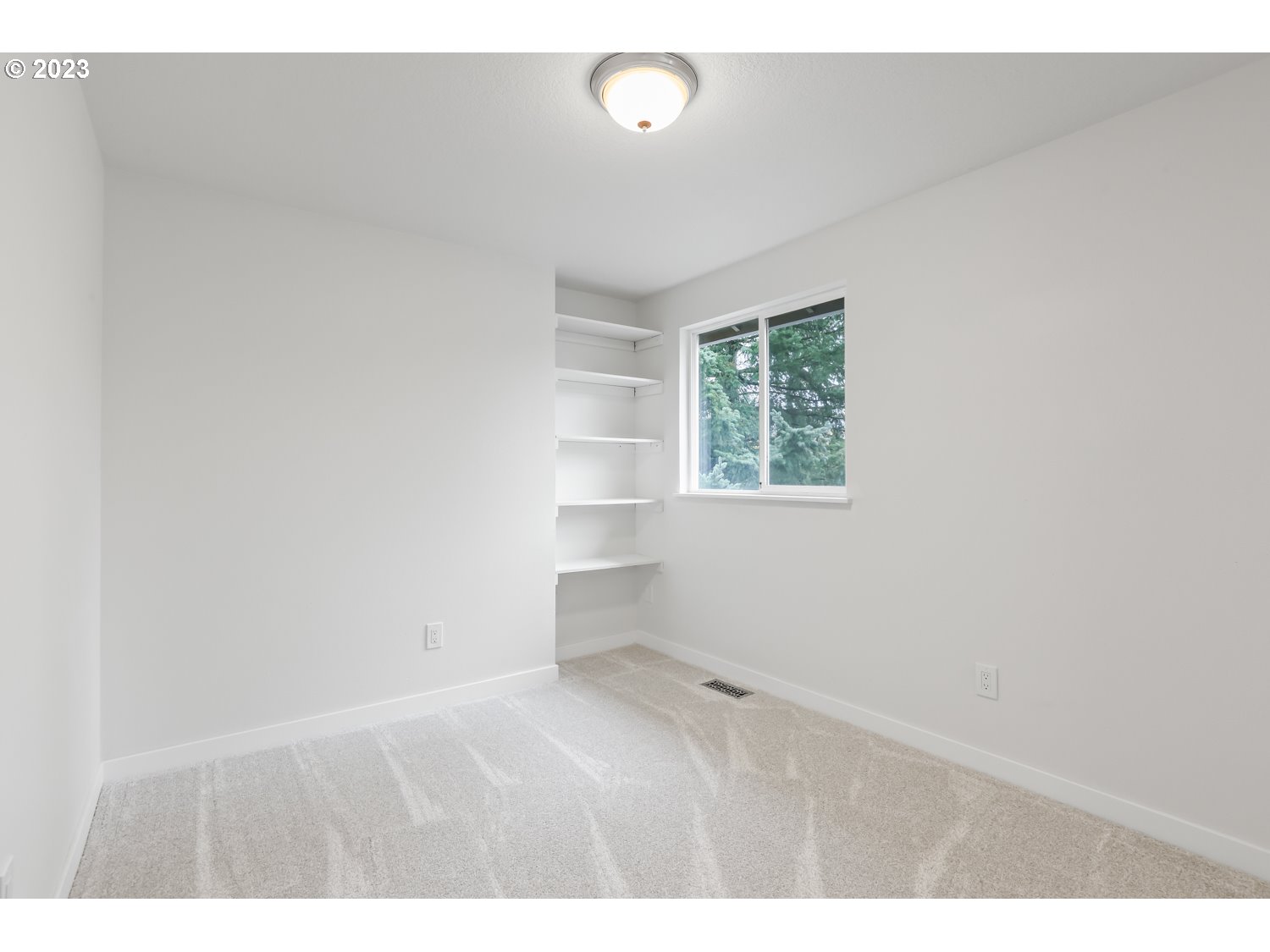 1203 Southeast Barnes Road Gresham, OR 97080 - Photo 32 of 43 a room with cabinet and windows
