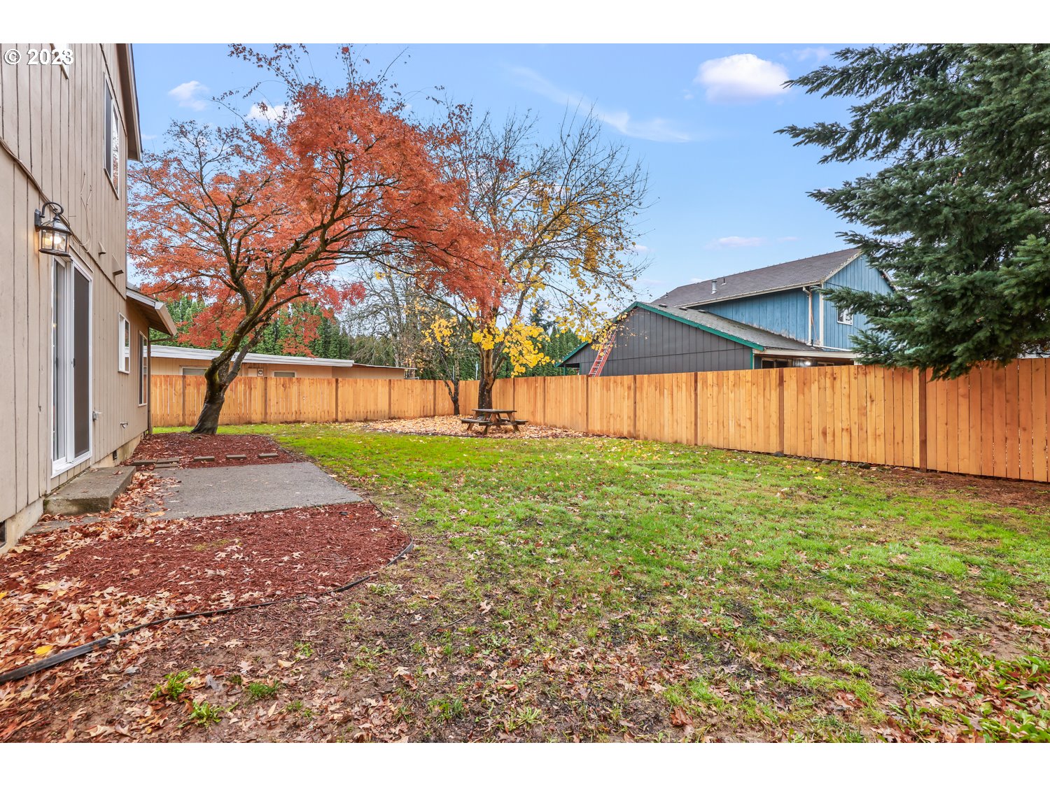 1203 Southeast Barnes Road Gresham, OR 97080 - Photo 34 of 43 a view of a backyard with large trees