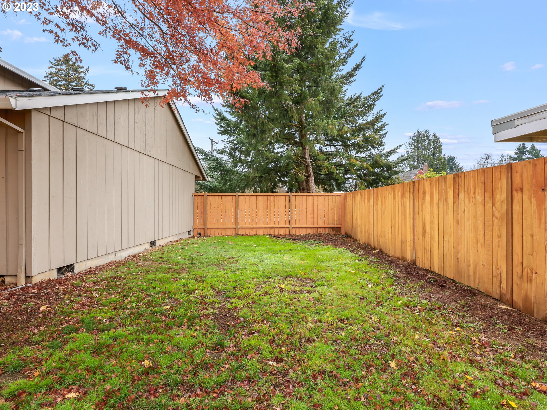 1203 Southeast Barnes Road Gresham, OR 97080 - Photo 40 of 43 a view of backyard with tub and trees