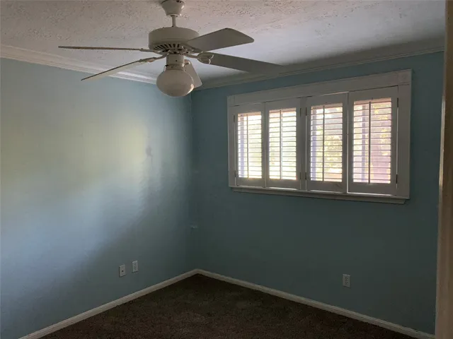 a view of small space with wooden floor and windows