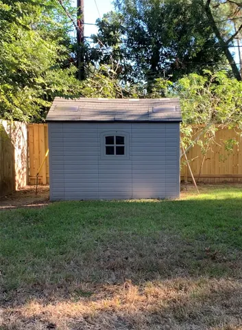 a backyard of a house with lots of green space