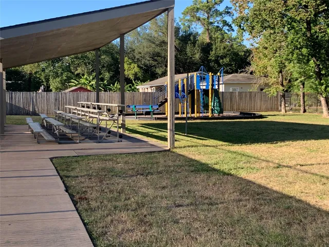 swimming pool view with a seating space