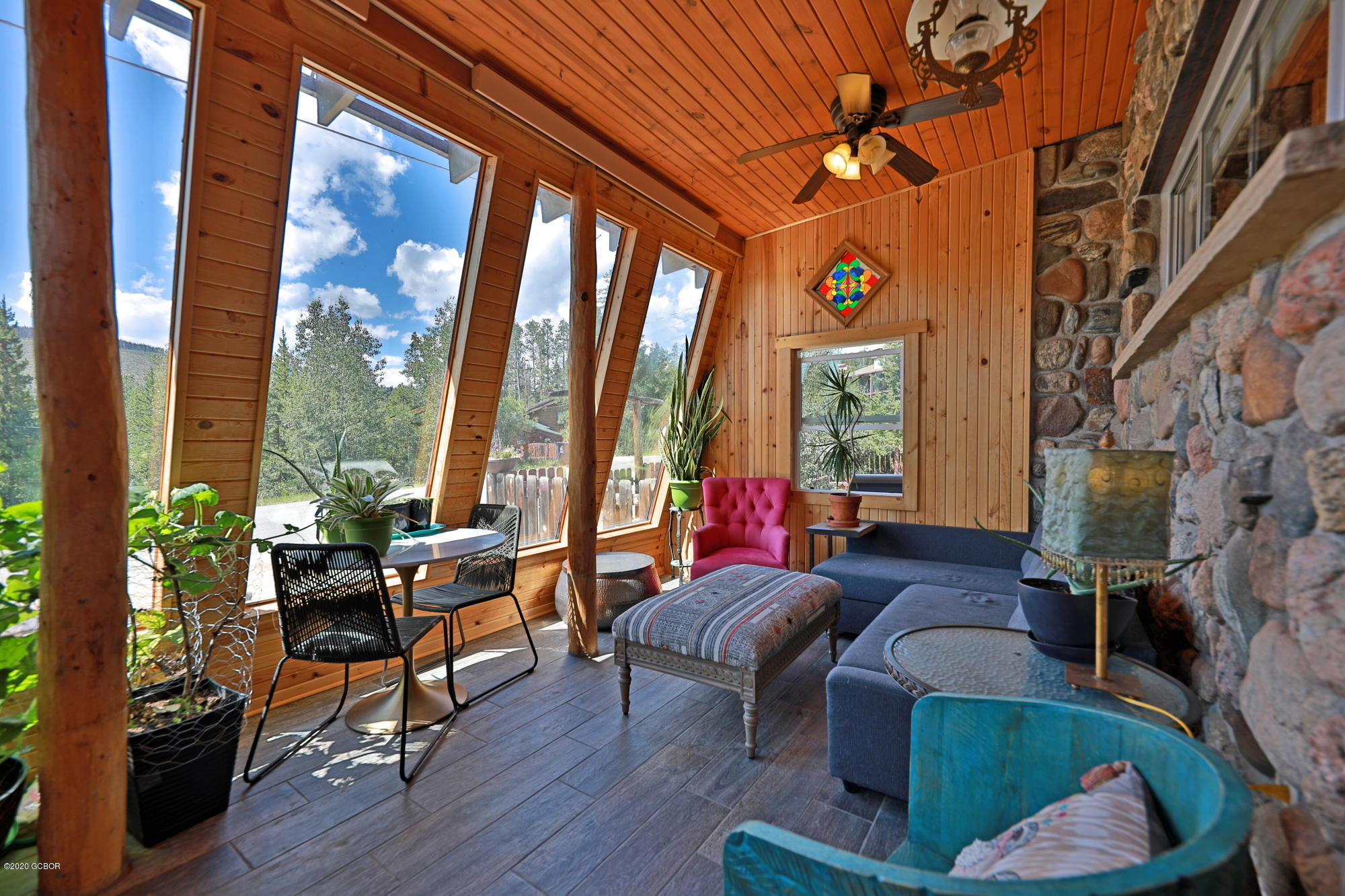 539 Kings Crossing Road Winter Park, CO 80482 - Photo 1 of 35 a living room with furniture and large windows