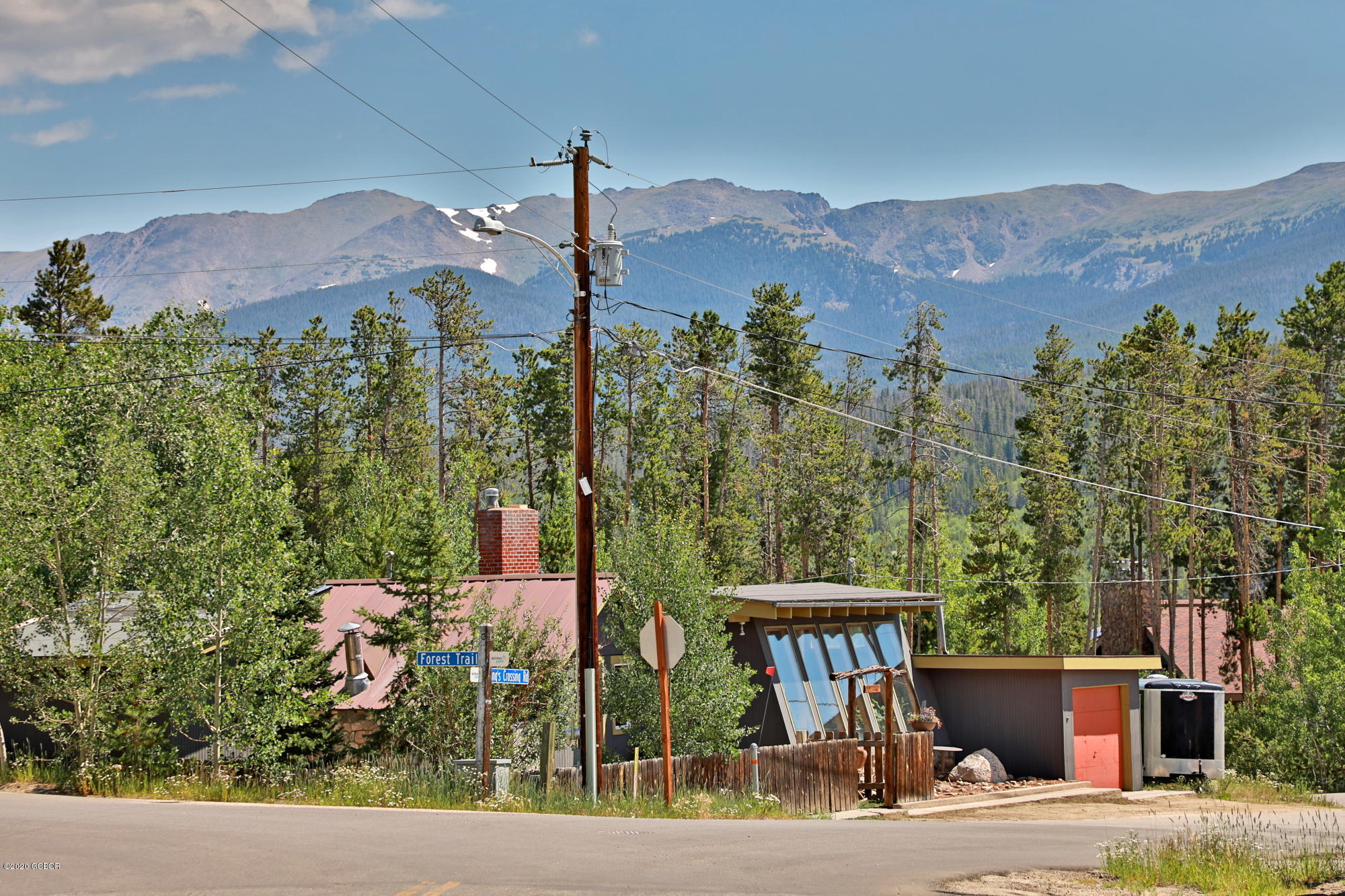 539 Kings Crossing Road Winter Park, CO 80482 - Photo 23 of 35 a front view of a house with a yard and mountain view