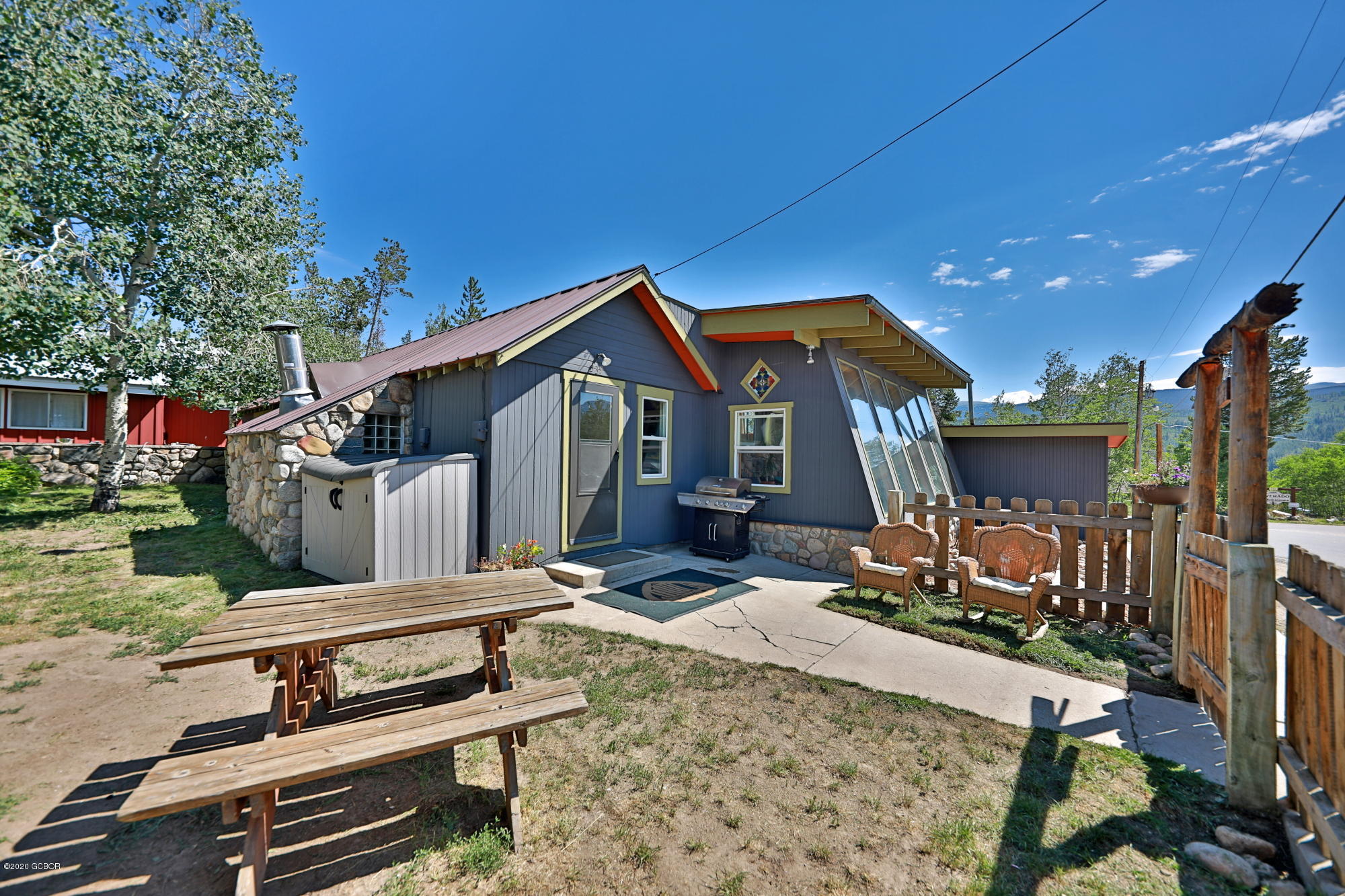 539 Kings Crossing Road Winter Park, CO 80482 - Photo 27 of 35 a front view of house with barbeque grill and couches
