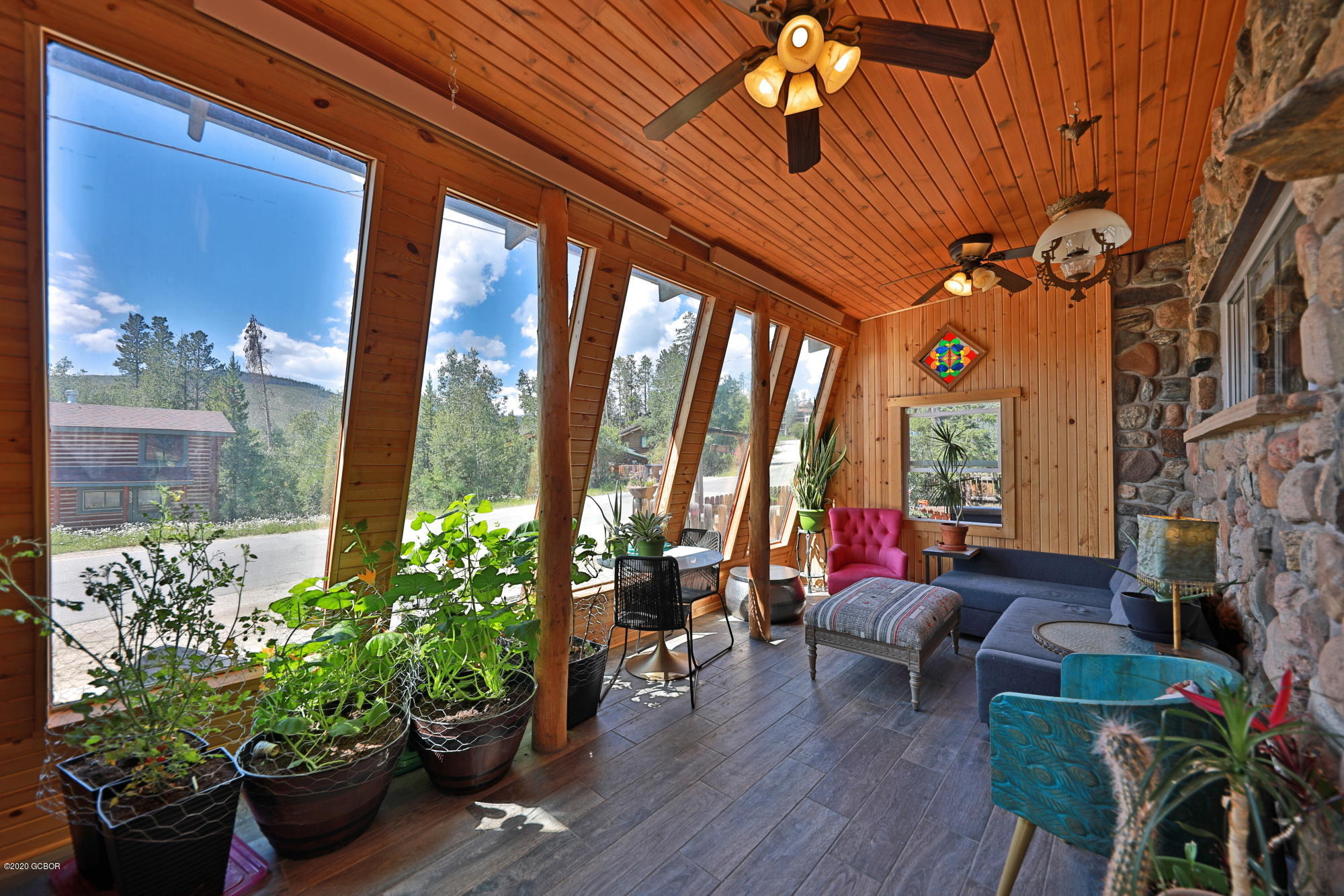 539 Kings Crossing Road Winter Park, CO 80482 - Photo 3 of 35 a living room filled with furniture and a potted plant