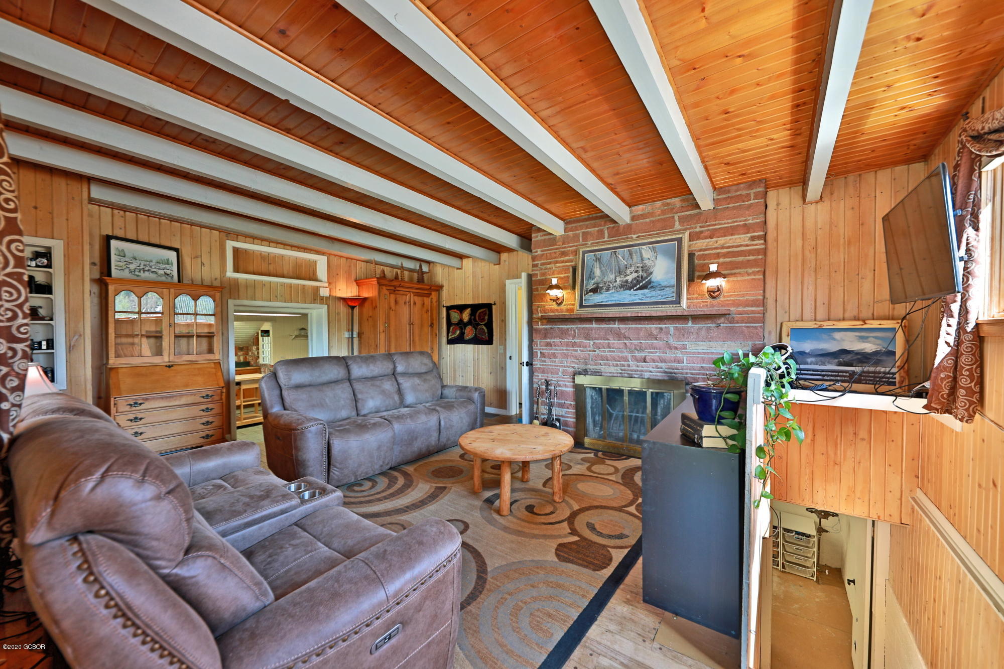 539 Kings Crossing Road Winter Park, CO 80482 - Photo 7 of 35 a living room with furniture and a fireplace