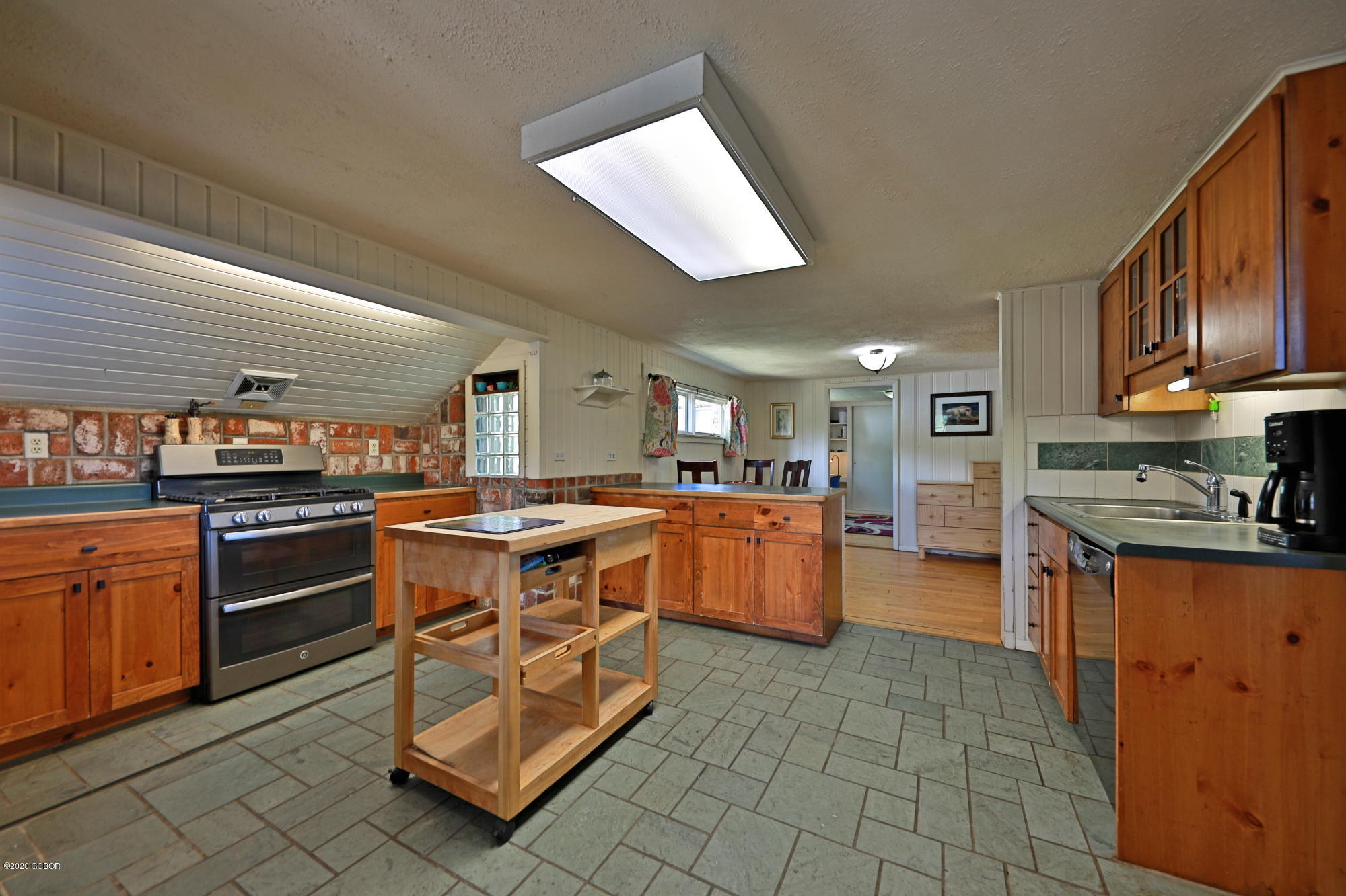 539 Kings Crossing Road Winter Park, CO 80482 - Photo 8 of 35 a kitchen with stainless steel appliances granite countertop a stove top oven a sink dishwasher and cabinets