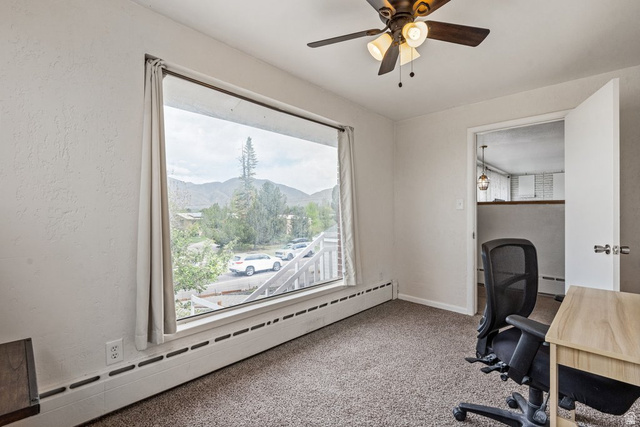 149 West 1600th Street South Mapleton, UT 84664 - Photo 23 of 44 Home office featuring baseboard heating, a mountain view, carpet flooring, and ceiling fan